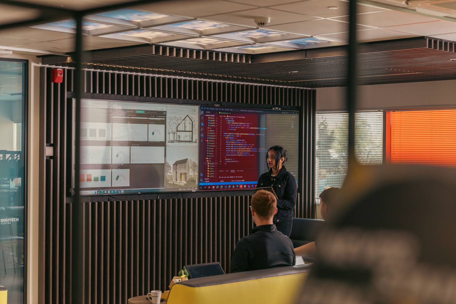 Students in front of hi-tech display screen