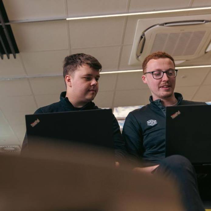 Students working on laptops at DigiTech