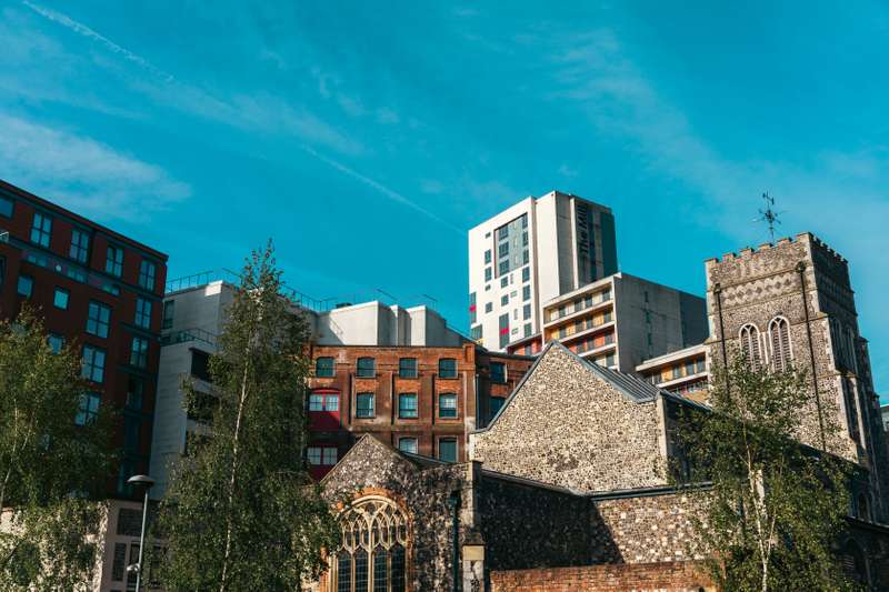 View of the The Mill from behind a church