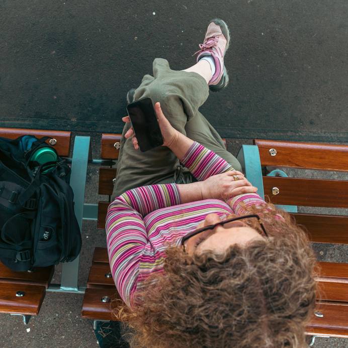 Student sitting at Ipswich railway station