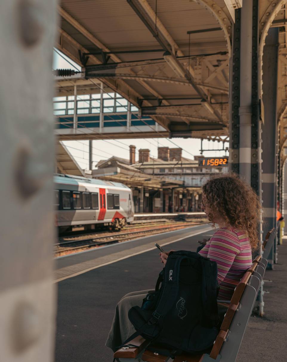 Abstract view of a student on a seat at Ipswich railway station