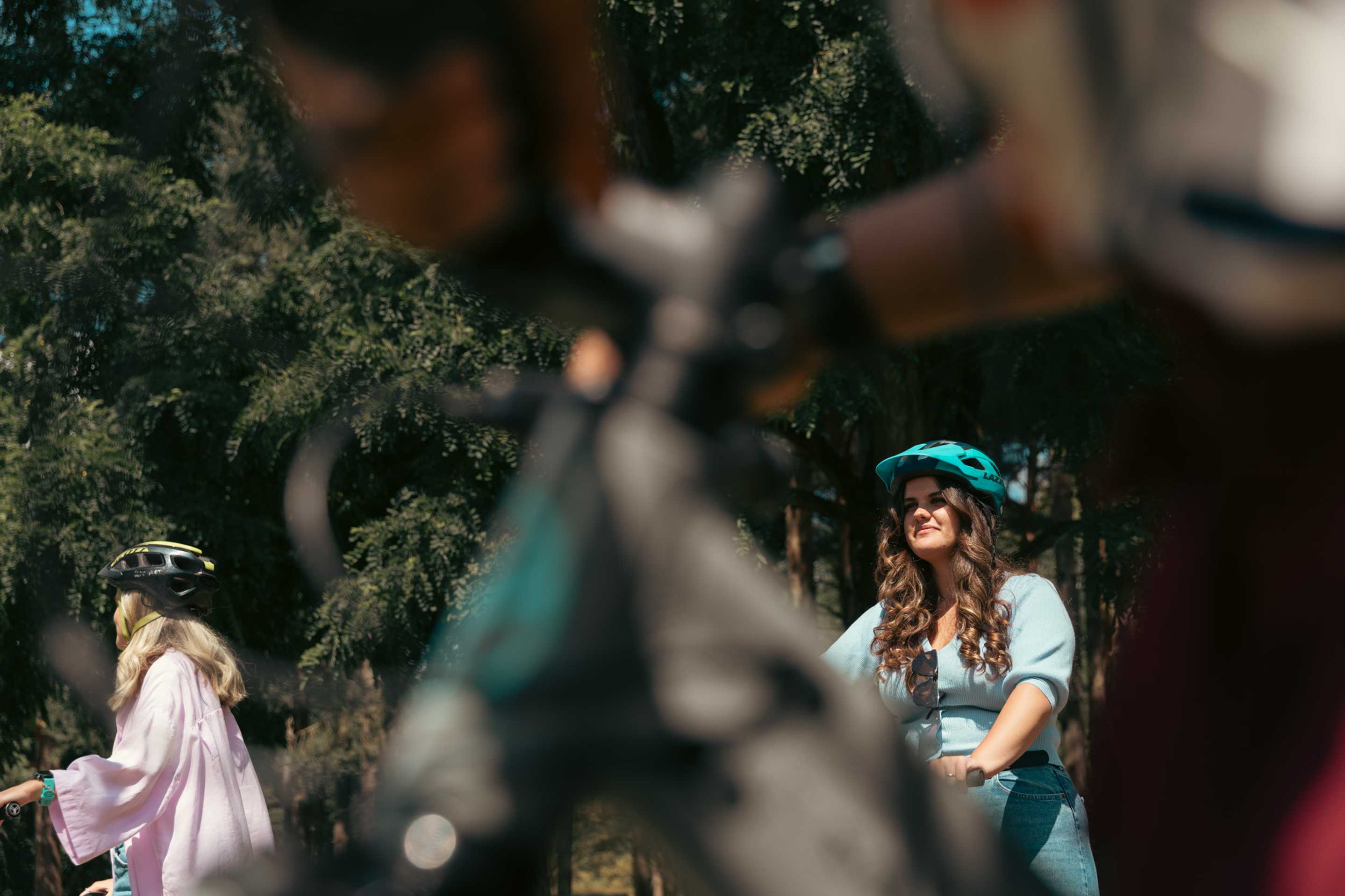 Students cycling in the woods
