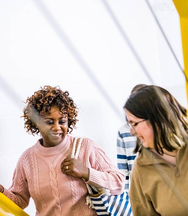 Two students walking up the stairs