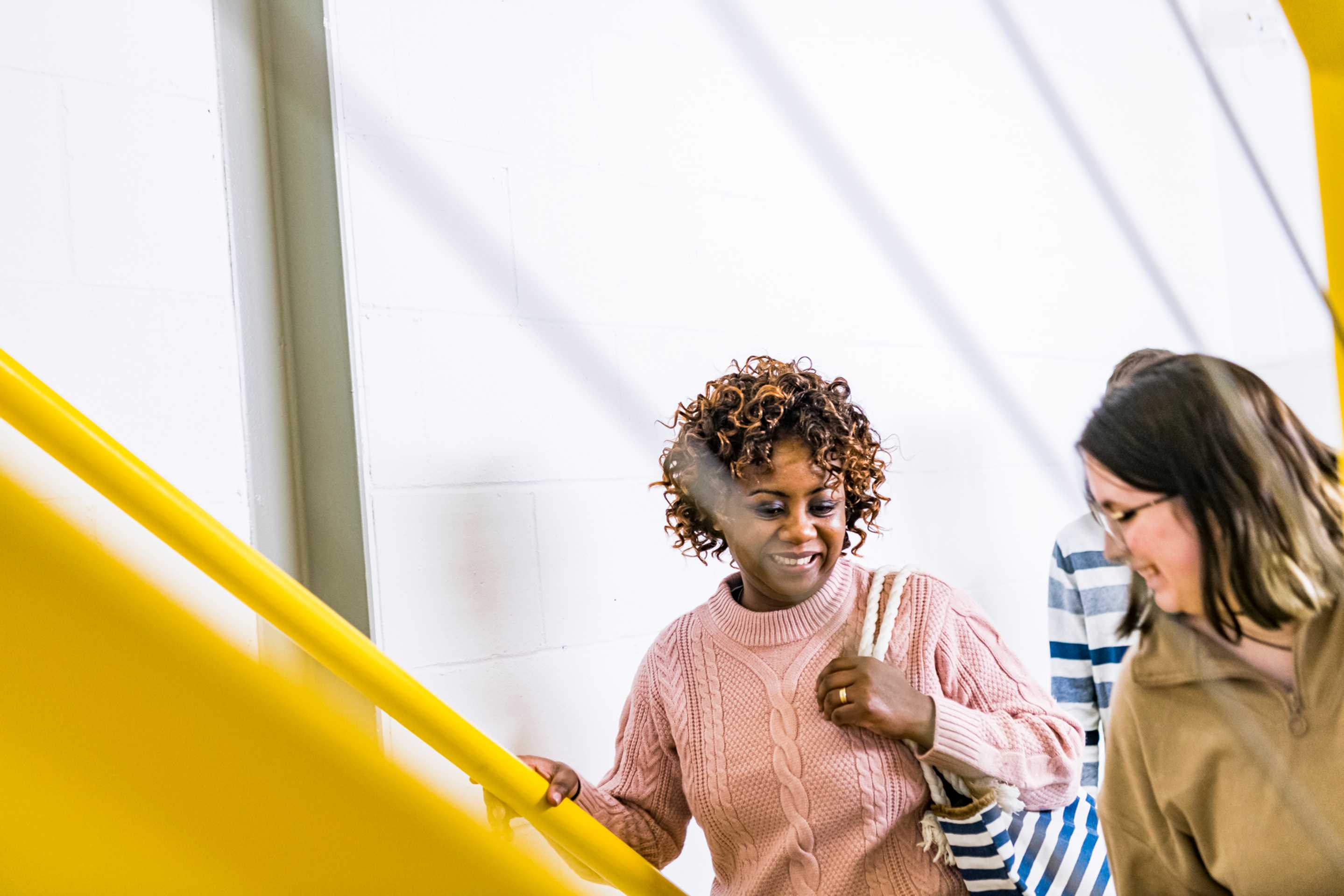 Two students walking up the stairs