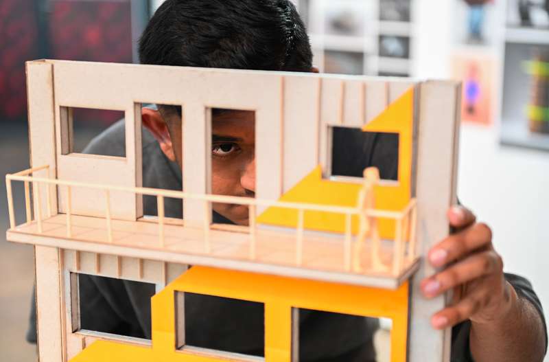 Close-up of a student looking at an architectural model