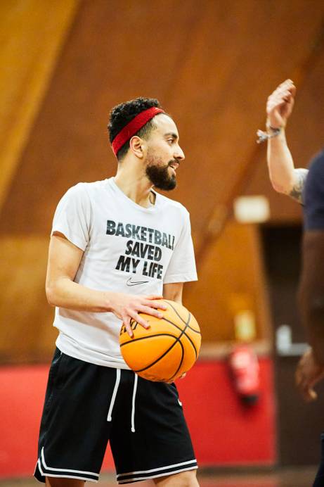 A student playing basketball