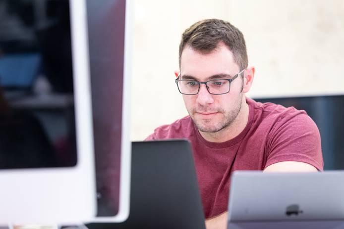 Close-up of a student sitting at a computer