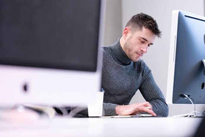 Close-up of a student sitting at a computer