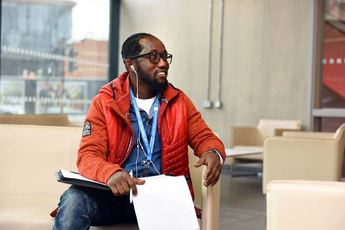 A student sitting, studying in the foyer