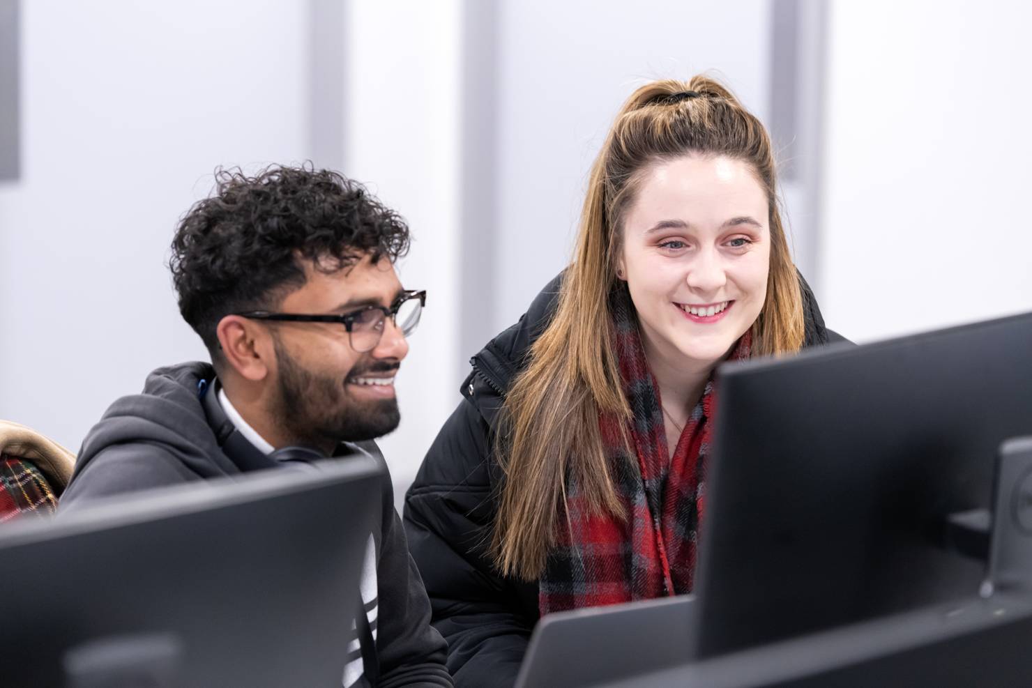 Two students sitting at computers