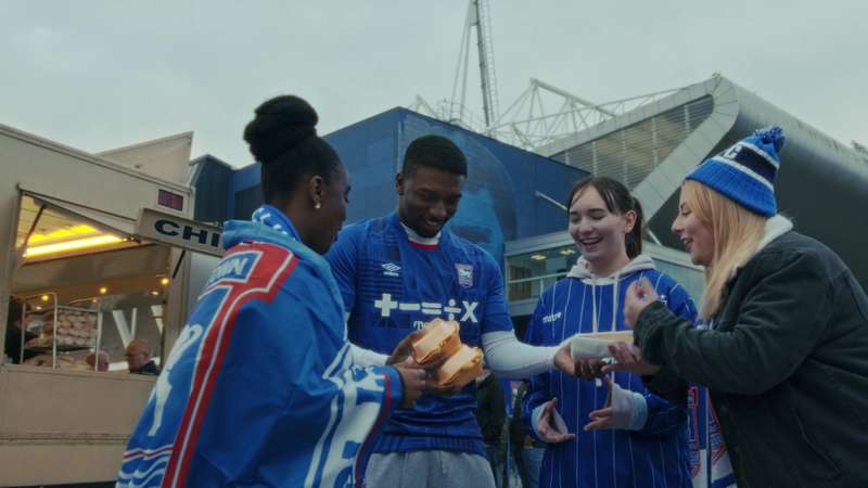 Students eating at Ipswich Town Football Stadium