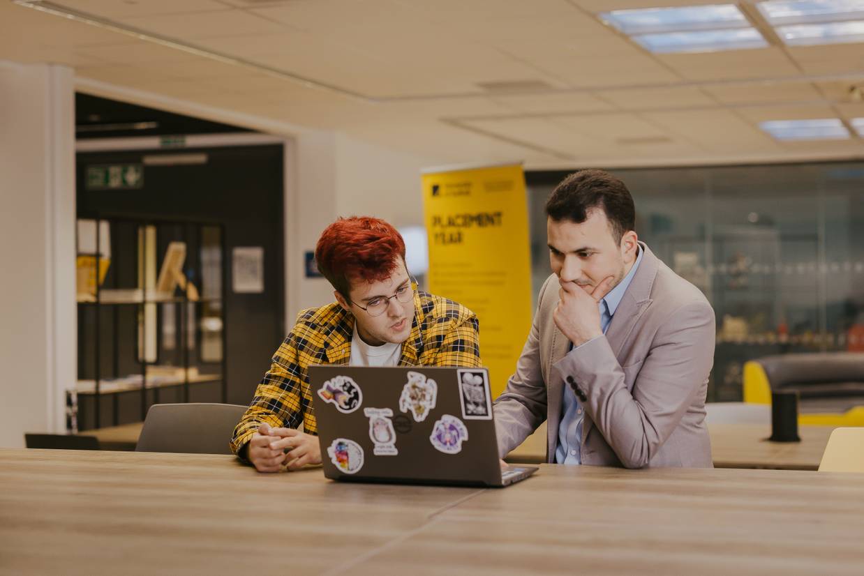computing student Conor O'Leary sit withs computing lecturer Ali Alhaj