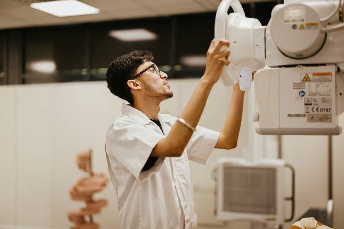 A student using an X-ray machine
