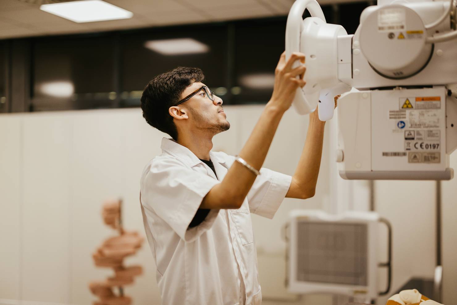 A student using an X-ray machine