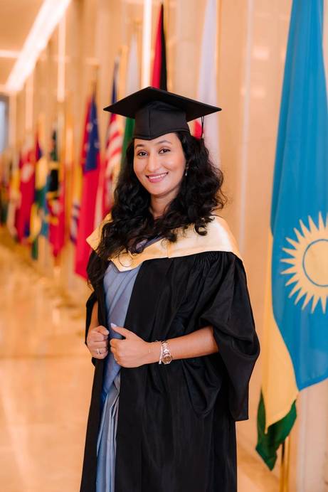 A graduate in a gown and cap