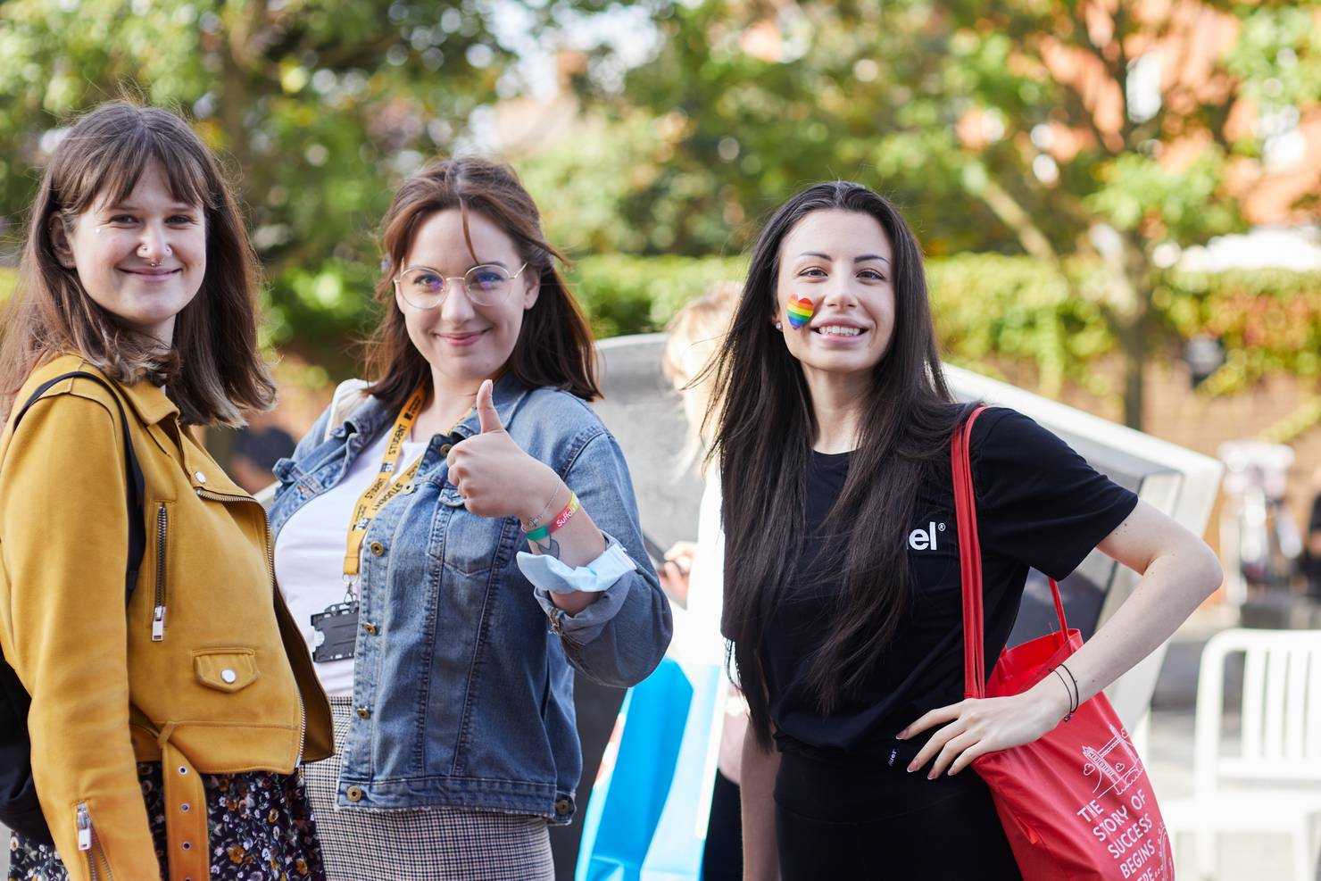 A group of students smiling on the plaza