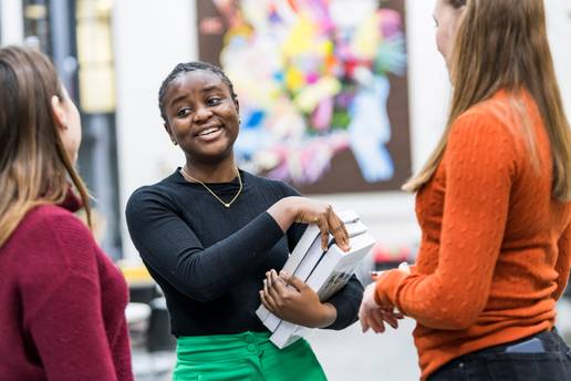A group of students standing and talking