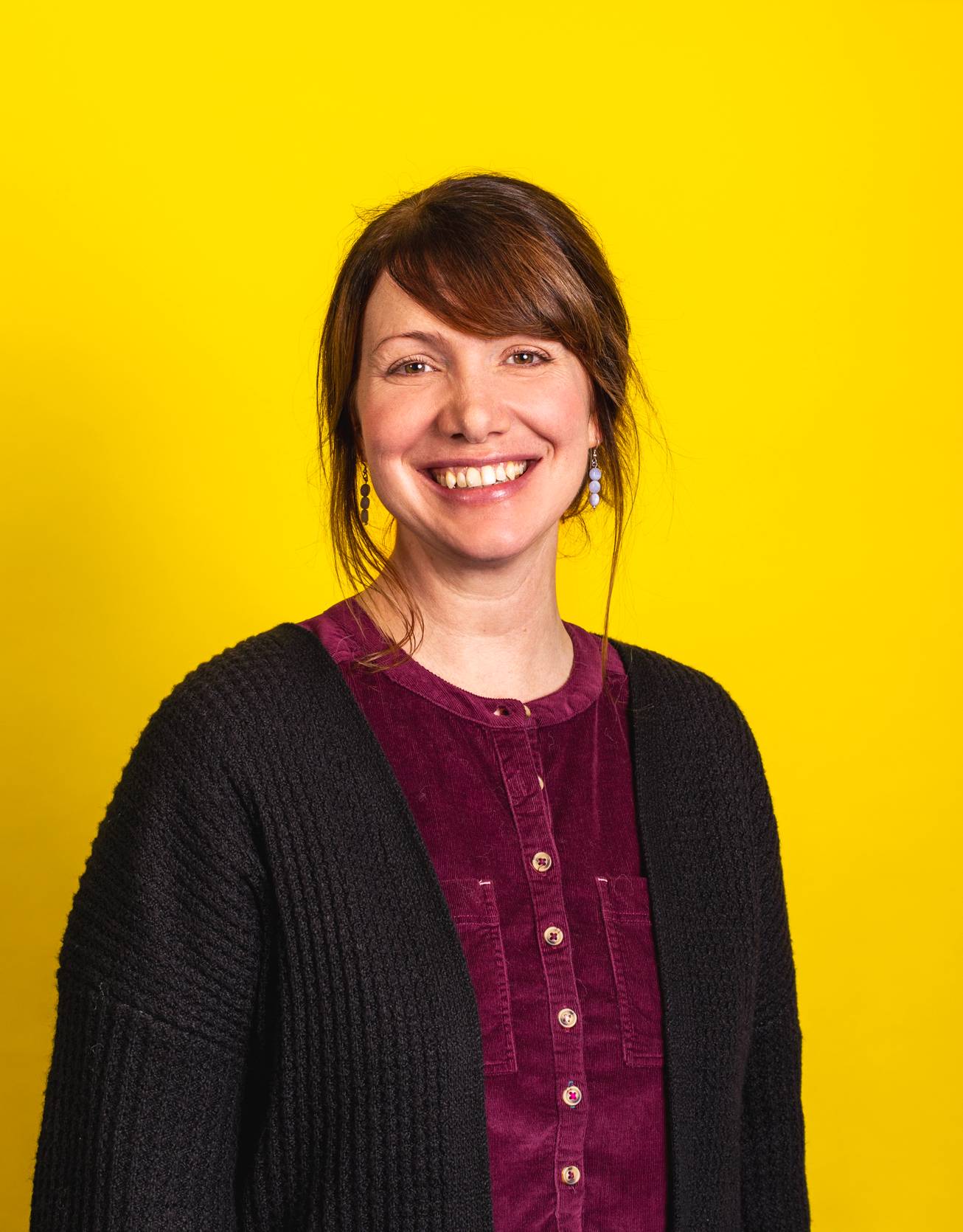 Lindsey Scott profile photo on yellow background