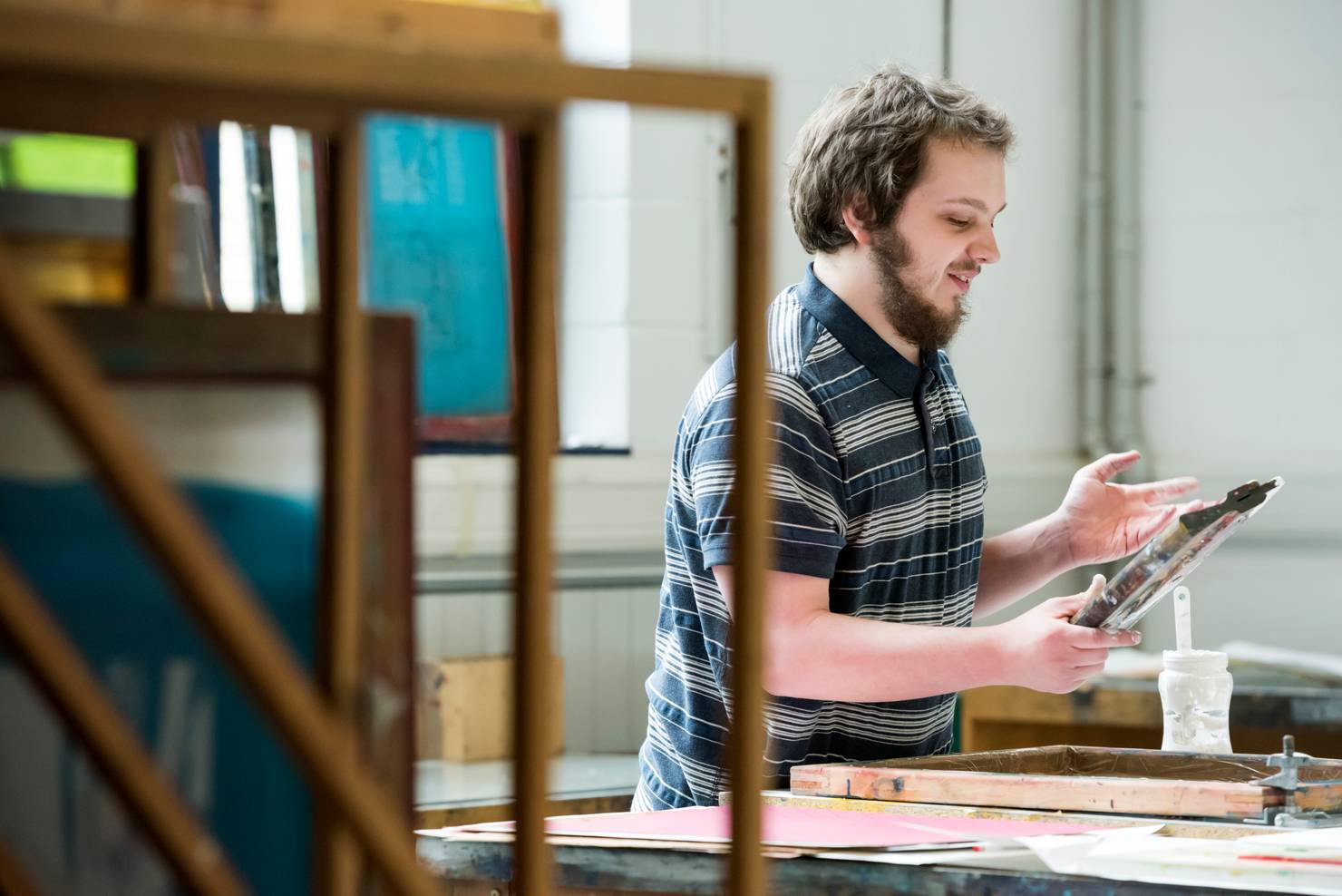 A student screen printing