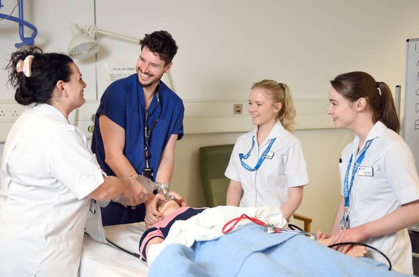 Students and lecturer using a manual resuscitator bag
