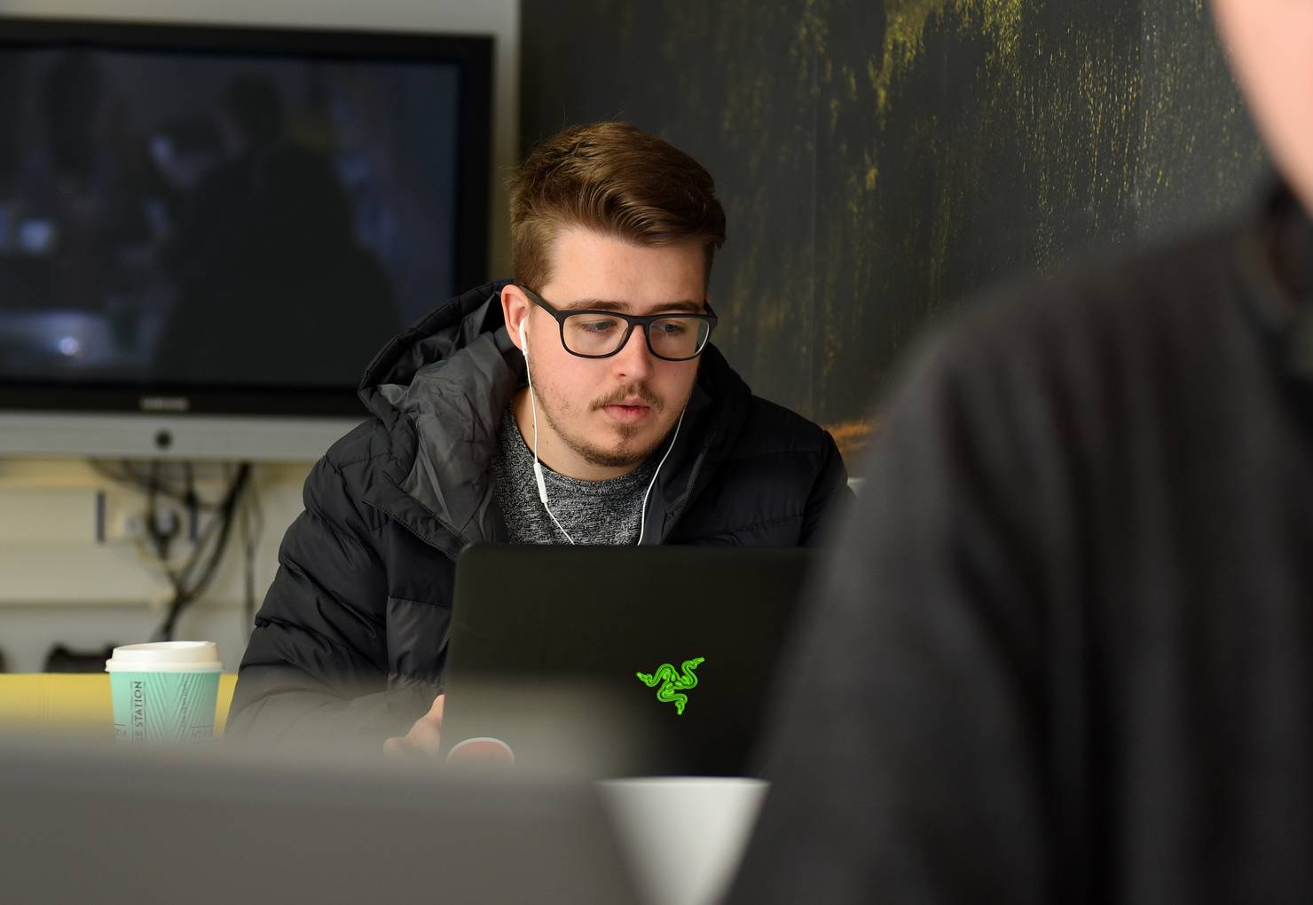 A student sitting with a laptop