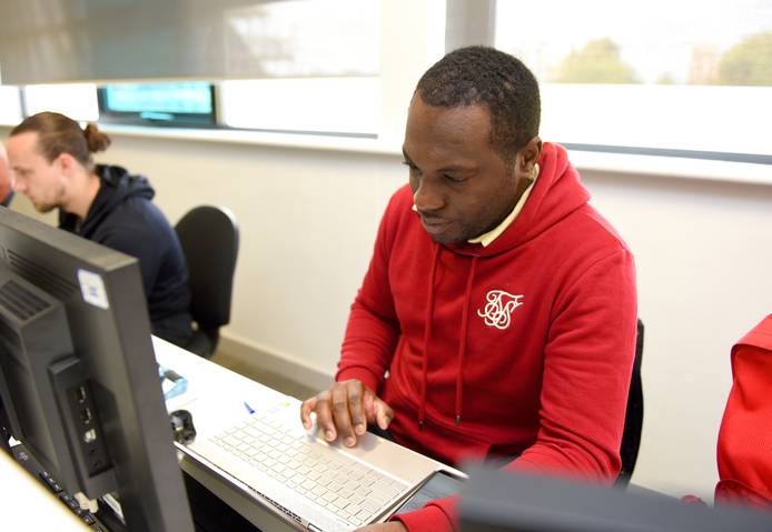 A student sitting at a computer