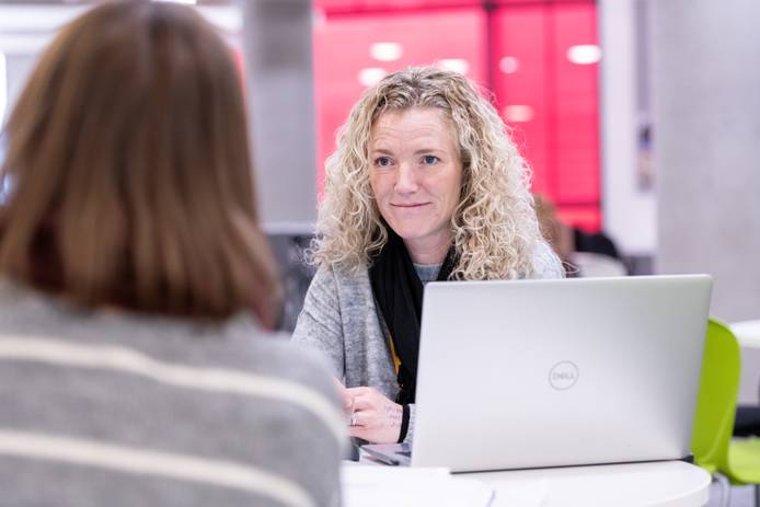Close-up of a student with a laptop