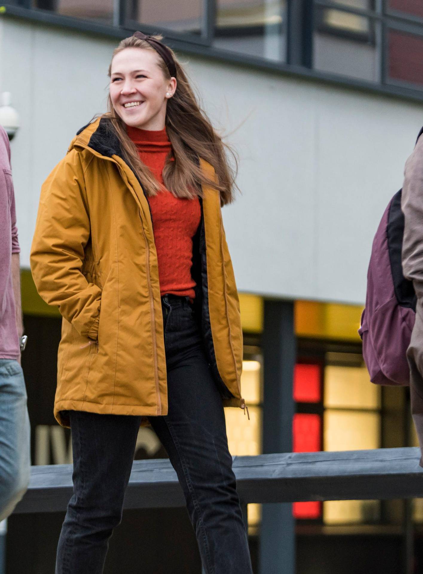 Group of student walk past The Atrium