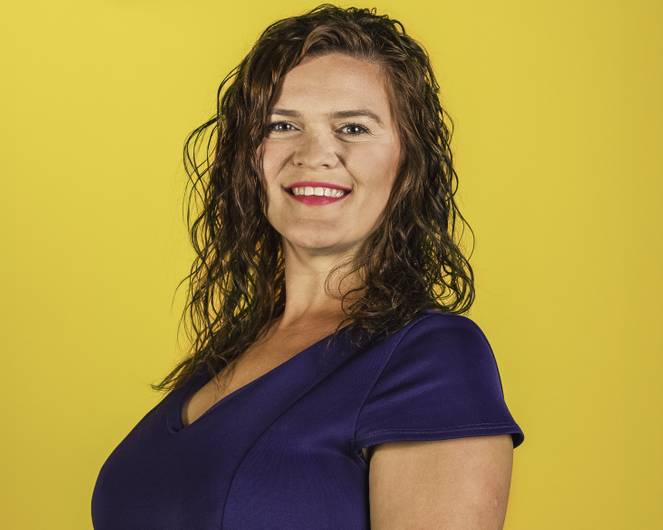 A head and shoulders photo of Dr Ruth Flaherty, smiling