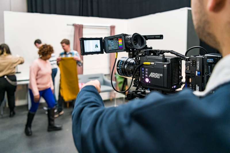 Students working in film studio