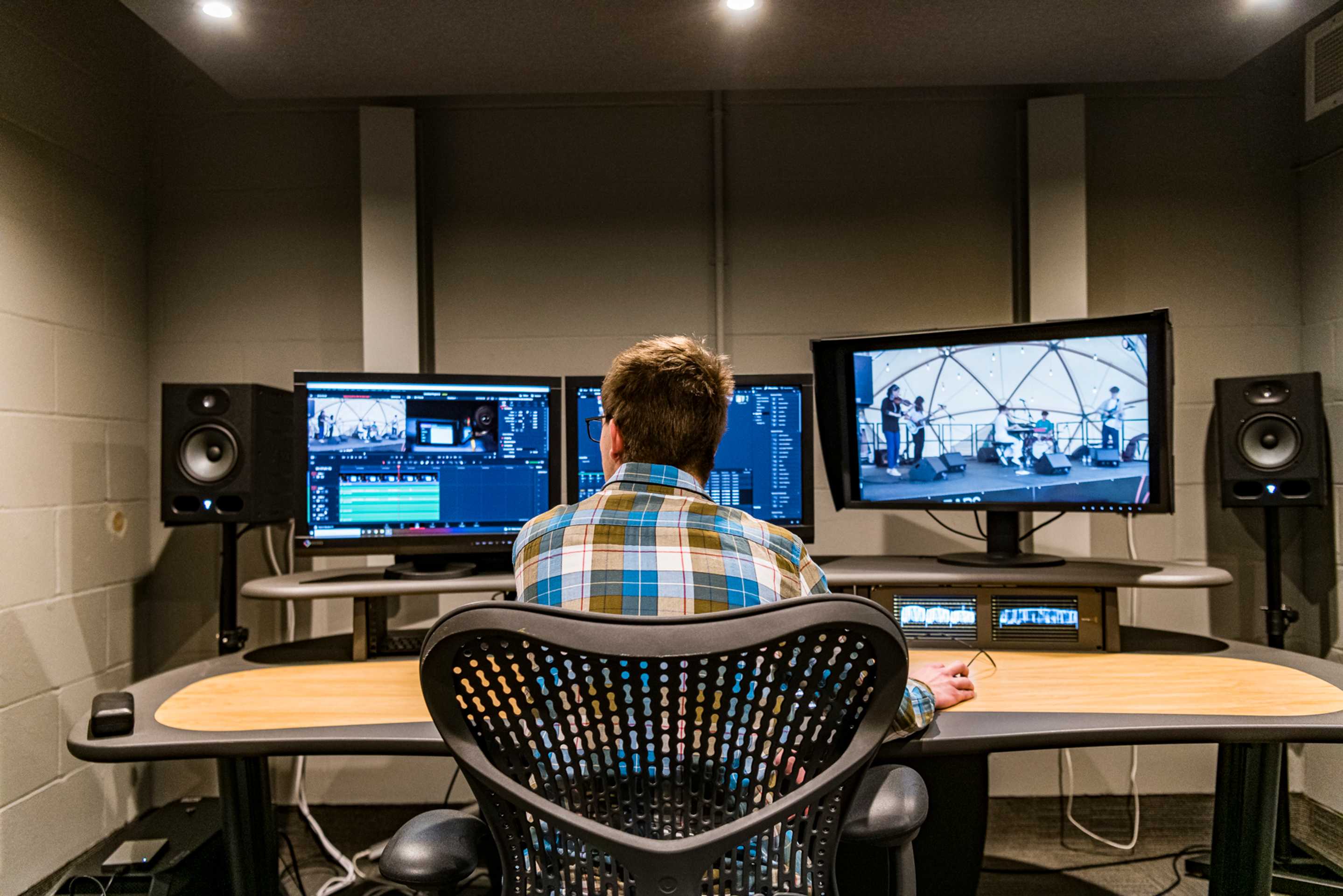 Student working in sound booth.