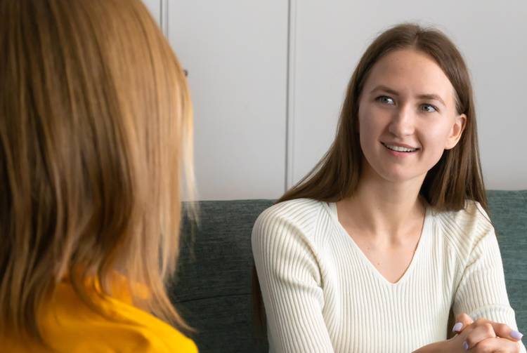 Women sitting talking to a counsellor/therapist
