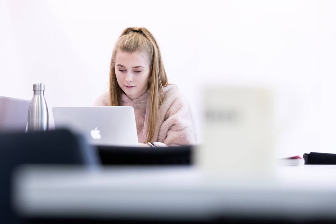 Close-up of a student on a laptop