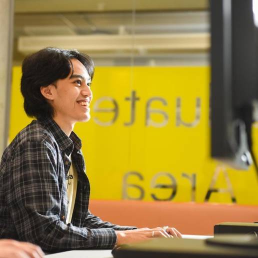 A student sitting at a computer