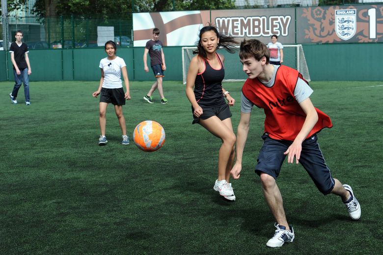 A group of student playing football