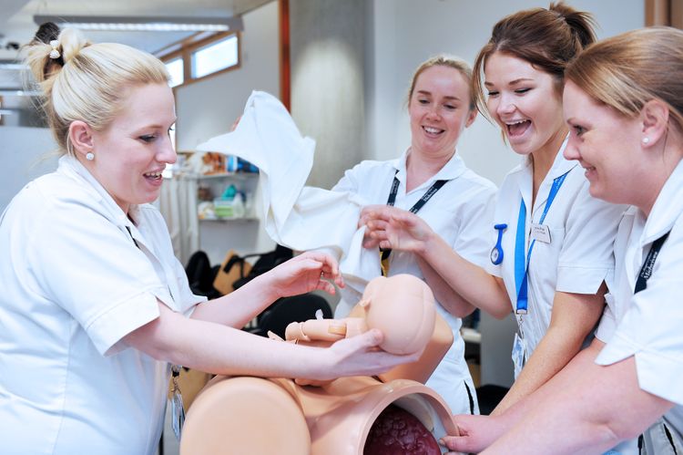 Midwifery students stimulating a caesarean