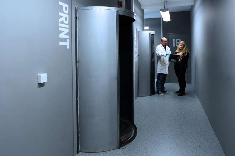 Student talking by booths.