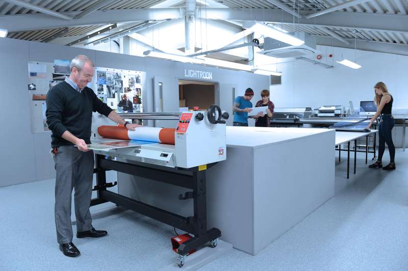 Teacher and students in print room