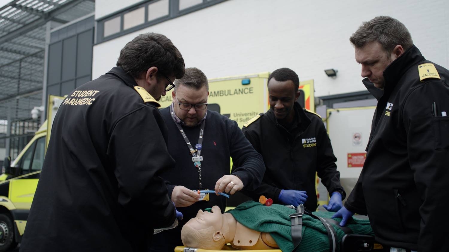 Paramedic students working on a simulated patient