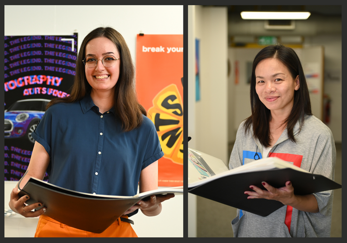 Maria-Teodora Dragomir (left) and Sammi Wong, both holding their arts degree show portfolios, smiling